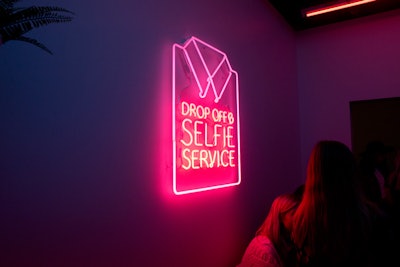 The laundromat features a neon sign that riffed off the theme of the room and the pop-up's overall motto of encouraging guests to take photos and share them on social media.