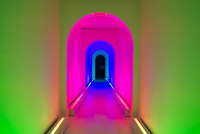 The next room is a hallway lit in rainbow, neon colors, which change with a lighting effect that's supposed to make guests feel like they're shrinking as they walk through.