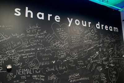 Guests are invited to sign or write about their experience on a chalkboard.