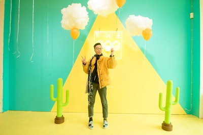 One of the first photo ops in the space features a neon sign with the name of the pop-up against a yellow and green backdrop. Guests can pose in front of the sign with yellow balloons that are placed in front of hanging pieces of cotton. The balloons against the cotton are meant to resemble sunny-side up eggs.