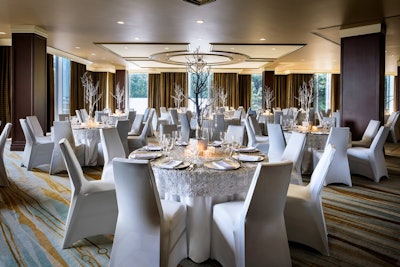 Regatta Ballroom set for a banquet dinner, offers natural light