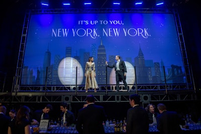 Other groups of dancers performed on platforms with dramatic backgrounds, including one depicting the New York skyline. To transition to cocktails, the dancers joined in a single high-energy performance and led guests to the dinner space.