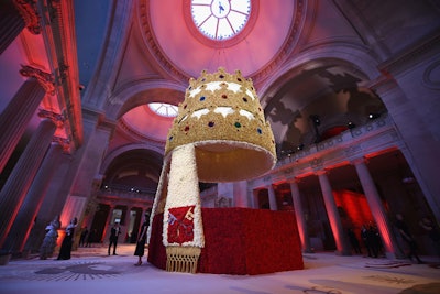 The crowning jewel of the evening's decor, the 30-foot-high floriated centerpiece created by gala designer Raul Avila and his army of staffers evoked the evening’s theme. The structure was inspired by a jeweled tiara, 'the most striking component of the Pope's ensemble,' said Avila, that once belonged to Pope Pius IX.