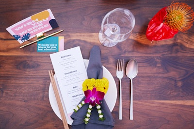 The conference’s V.I.P. dinner had a tropical theme, with colorful flowers and postcards that served as place cards.
