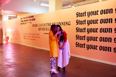 Inspirational and educational phrases such as 'Start your own shit' and information on equal pay adorned the conference's walls.