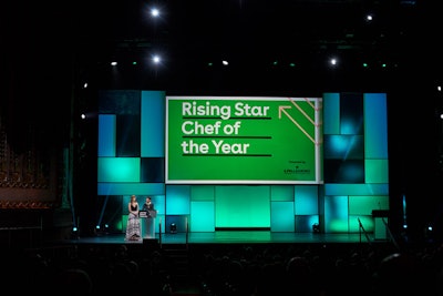 The illuminated color blocks and projection screen in the stage design changed shades throughout the awards ceremony.