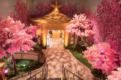 Cherry blossom trees adorned the entrance to a space called the Golden House.