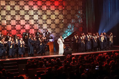 With special acts by Wynton Marsalis and, in a surprise, Paul Simon, the performance portion of the evening ended on a rousing note with Shirley Caesar and a gospel choir that, after arriving on stage from the orchestra level, had the crowd on their feet clapping and singing along.
