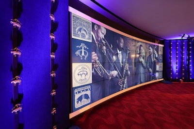 The Firm used state-of-the-art technology to pay homage to Brooks Brothers' rich history. Directly adjacent to the main party space, the Ertegun Hall of Fame featured massive video animations that provided a visual journey via contrasting images from the early 1800s to today. Vertical rows of Golden Fleece sheep were suspended in the air for a dramatic visual effect.