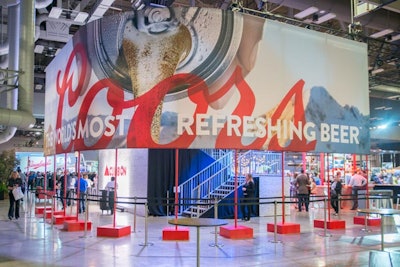 The Coors Light booth was inspired by the brand’s tagline “Climb On,” featuring decor that evoked a mountain setting and motivational messaging in bold red. Stairs led guests up to a patio that offered a full view of the brand showcase. The booth offered guests Coors-branded Yeti Colsters and featured an LED wall showcasing its latest ads.