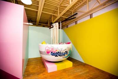 For the culinary room, artists Troublesome Troy and SmugUgly designed a noodle-theme vignette inspired by their recent trip to Japan. Guests could pose in a life-size bowl of “ramen” with 'noodles' that hung from oversize chopsticks.