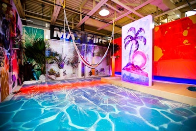 The beach-theme “Don’t Summer Break Without It” room showcased colors and textures inspired by Miami. Design and decor elements included a hammock, a purple palm tree illustration, and a multi-color “pool.” The room was created by Francis Pratt and Mango Peeler.