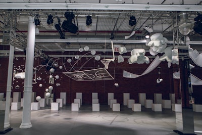 The installation was created with 376 items, which were hand strung from the ceiling of a vacant event space in SoHo. A transparent basketball court and hoop reflected the headset's N.B.A. League Pass.
