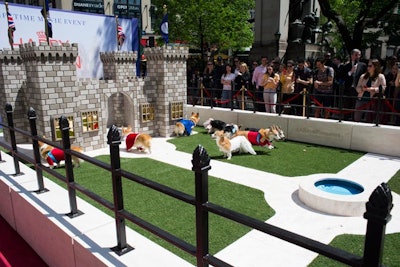 Guests gathered in Herald Square to watch the royal corgis play in front of a doggy-size replica of Windsor Castle.