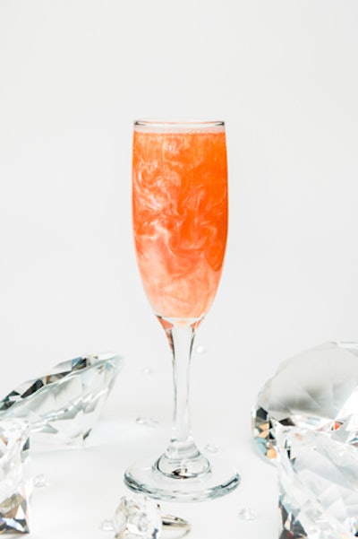 The Royal Wedding PUB's Markle Sparkle is a spritz-style cocktail with rose cider and edible glitter.