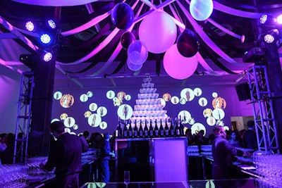 A purple-lighted room featured a bar that served glasses of FIOL Prosecco. Balloons and streamers mimicked the inside of a circus tent.