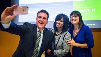 Speakers take a selfie during the conference