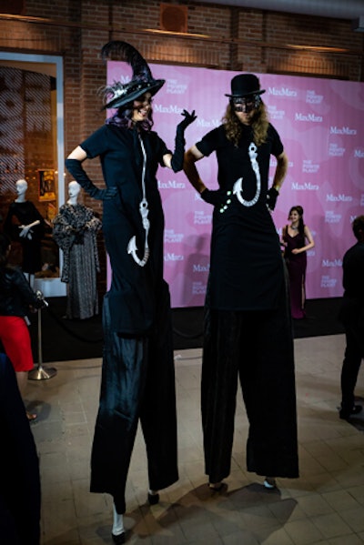 Throughout the evening, stilt walkers danced with guests and walked through the crowd.
