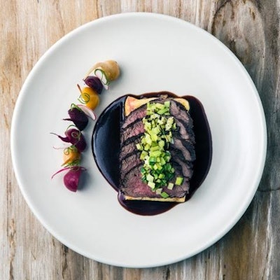 Beef tenderloin with leek relish, polenta, roasted rainbow beets, and red wine reduction
