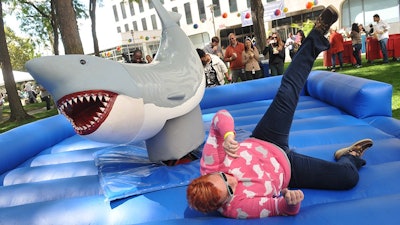 A guest trying out the mechanical shark ride