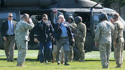 Medal of Honor recipients exit a helicopter for the Boston Convention