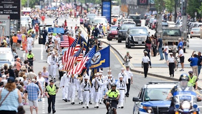 A parade through the streets in Boston's Seaport