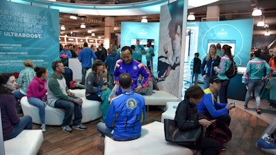 Attendees relaxing in an expo booth