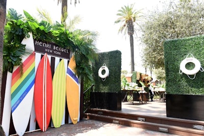 In April, influencers and guests gathered to celebrate the launch of Henri Bendel's Surf Sport Collection at the Bungalow in Santa Monica. The photo wall was constructed of bold striped surfboards.