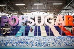 The festival's massive, Instagram-worthy installation displayed the name of the company looming over slides in different colors, which attendees could ride into a giant ball pit.