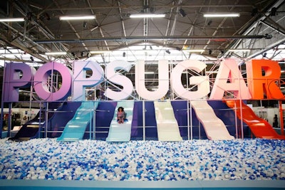 The festival's massive, Instagram-worthy installation displayed the name of the company looming over slides in different colors, which attendees could ride into a giant ball pit.