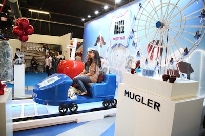 Perfume and jewelry brand Mugler's activation was inspired by a fair, complete with a roller coaster photo op and a mini Ferris wheel.