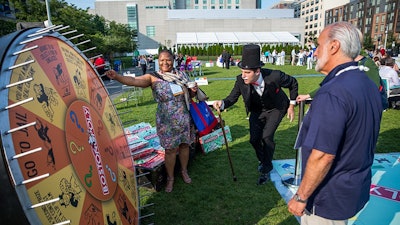 Guests take a chance at the conference's opening reception at Lawn on D
