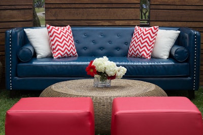 National furniture rental company Designer8 has several red, white, and blue options for events, including the blue Sebastian sofa and red leather square ottomans. (The pictured look also features the company’s Soleil coffee table.)