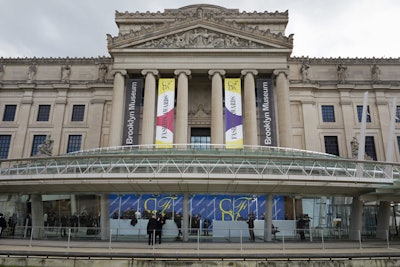 The C.F.D.A. Fashion Awards, held for the first time outside of Manhattan in 37 years, took place at the Brooklyn Museum at the cultural crossroads of Prospect Heights, Crown Heights, Flatbush, and Park Slope. A pair of custom banners announcing the Awards flanked the Beaux-Arts building's columns, while the bright step-and-repeat framed the glass-enclosed atrium directly beneath.