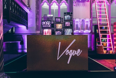 A DJ booth paid homage to voguing, a dance that originated in the queer ball community. The booth featured a backdrop of vintage TV props.