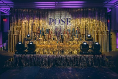 A replica of the trophy stage from the series—inspired by ballroom stages from the 1980s—stood in the front of the venue. The stage was available for guest photo ops and was also where judges gave their scores for the ball.