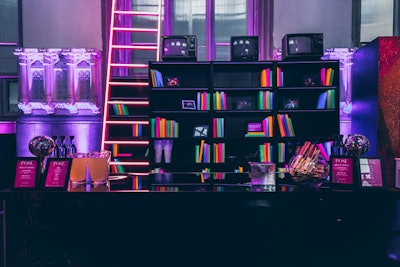 A bar served on-theme cocktails and displayed a neon library and a 20-foot LED ladder.