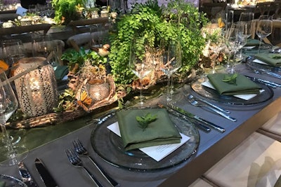 Also in the woodland area, Gillian Valentine used green napkins and table runners, greenery and branch centerpieces, and butterfly decor to complete the look.