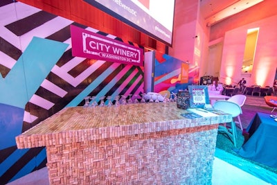 City Winery and NoMa's bars served drinks on a bar made of wine corks. Neon graphic patterned backdrops were created by D.C. artists No Kings Collective.