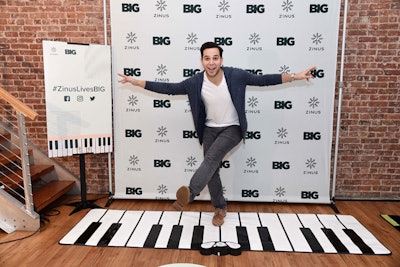 Actor Skylar Astin promoted the pop-up, and posed in front of the event's step-and-repeat—which featured a floor keyboard that played notes, inspired by the FAO Schwarz keyboard in the film.