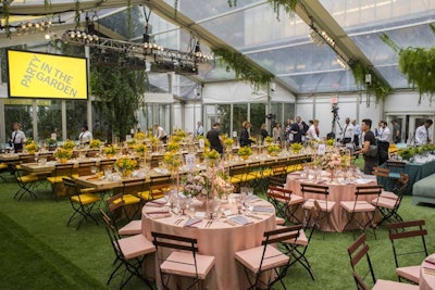 Inside the tented dining space, sections of round and rectangular dining tables were decorated in four distinct springtime shades—sunshine yellow, robin’s egg blue, rich teal, and cherry blossom pink.