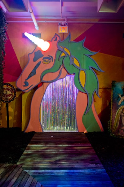 The entrance to the next room, a sherbet-hued, Coney Island-inspired fairground, displayed a massive unicorn. The magical creature is featured prominently on Coach products. The room also incorporated reclaimed wood from the actual Coney Island boardwalk.
