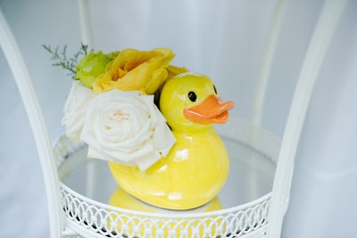 Throughout the party, ducks were used as bud vases.