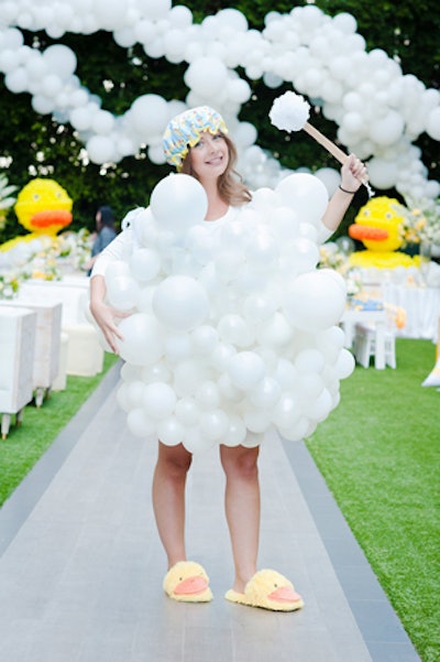 At the entrance to the event, a greeter set the tone by wearing a dress made from balloons, as well as rubber-duck slippers and a shower cap.