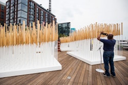 Visitors were able to wander through the field of Louisville Slugger bats. On the other side, a lathe operator was creating bats from the wooden billets, which were then added back to the “field” as completed bats.