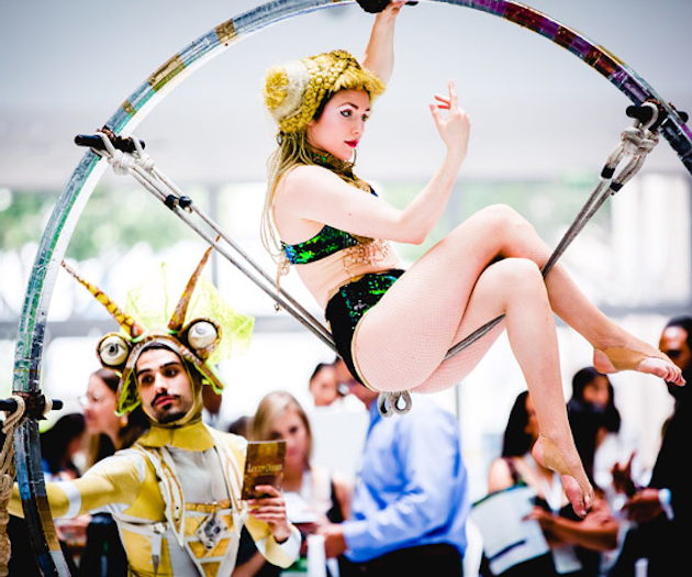 Los Angeles-based entertainment company Lucent Dossier provided costumed circus-theme performers throughout the day. The company can supply customized entertainment packages, including large stage shows, roaming characters, interactive stations, aerial performers, and more for social and corporate events. Previous clients have included Google, Warner Bros., and Dr. Dre. Lucent Dossier can also handle event production and design, creating gatherings with themed performers, lighting, menus, decor, and more.