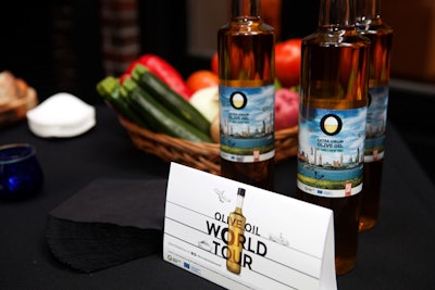 The kickoff event displayed bottles of extra virgin olive oil wrapped in the campaign imagery, which displays skylines from cities where the tour will travel.