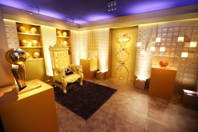 A golden vault tied into American Express’s long partnership with the Los Angeles Lakers. A 500-pound door led to a room with 500 safety deposit boxes and 30 gallons of gold paint, along with gold basketballs and hoops on the wall.