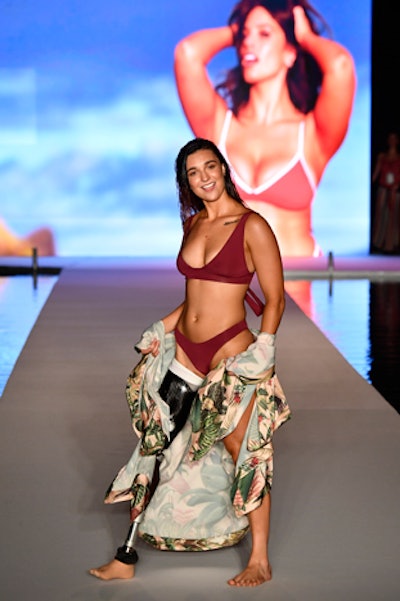 American snowboarder and Paralympian Brenna Huckaby opened the show in a burgundy swimsuit. The show closed with 2018 Sports Illustrated Swimsuit cover model Danielle Herrington.