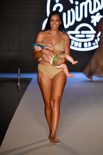 A model from the open casting call walked the runway as she breastfed her baby. More than 40 swim brands were modeled, including Stella McCartney, Reina Olga, and Jonathan Simkhai.